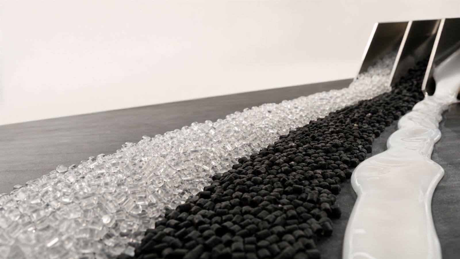 Polymer pellets, rubber granules and latex arranged as parallel material streams
